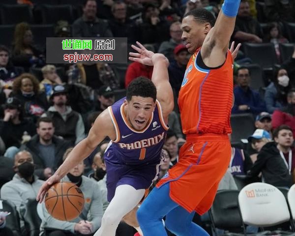 Phoenix Suns forward Mikal Bridges (25) shoots in front of Oklahoma City Thunder forward Isaiah Roby (22) in the first half of an NBA basketball game Thursday, Feb. 24, 2022, in Oklahoma City.