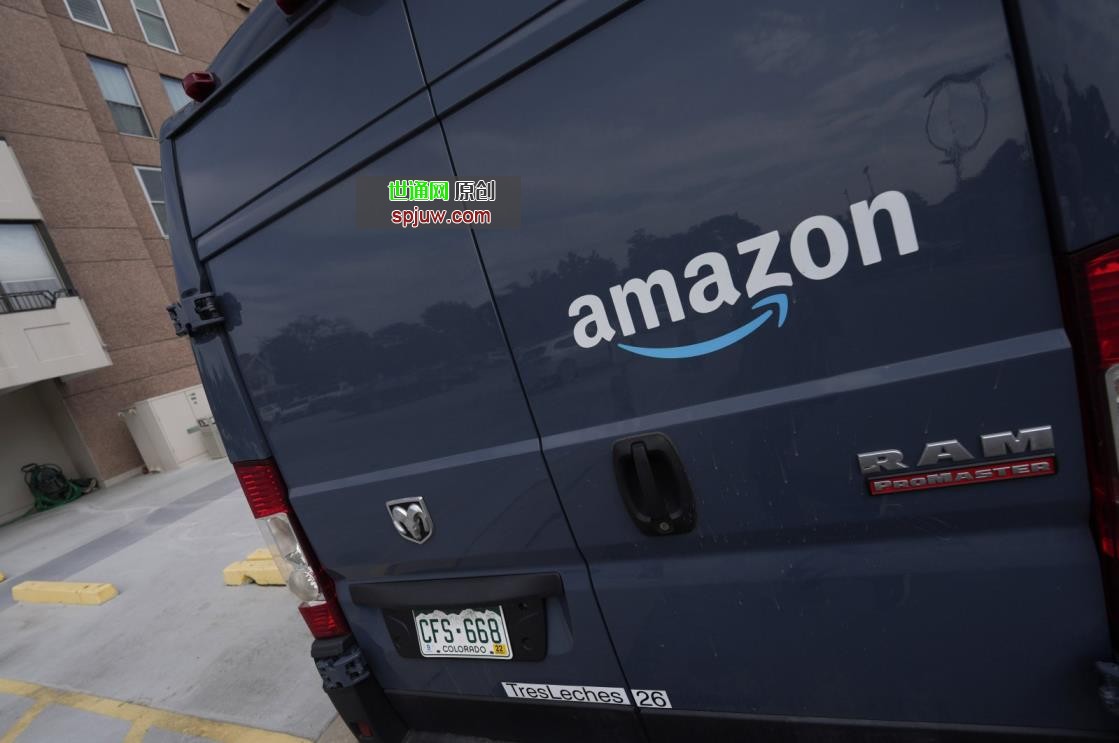 Amazon&#039;s company logo graces one of the doors of a delivery van in Denver, U.S., Sept. 1, 2021. (AP Photo)