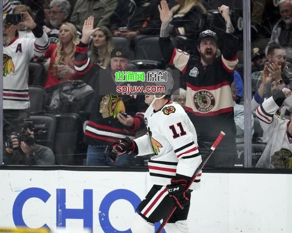 Chicago Blackhawks right wing Taylor Raddysh celebrates his goal during the first period of an NHL hockey game against the Anaheim Ducks Wednesday, March 23, 2022, in Anaheim, Calif.